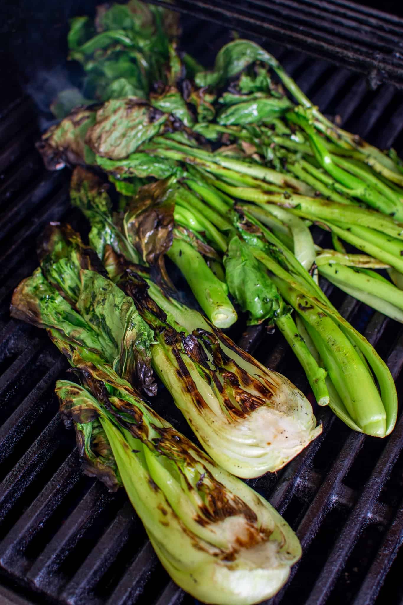 asian greens being grilled on a BBQ