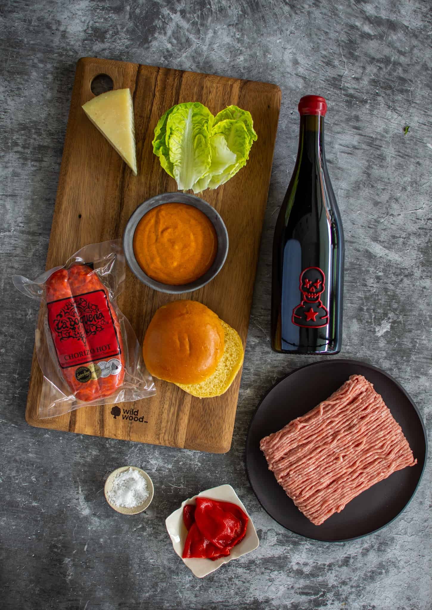 Birdseye view of ingredients needed to make a spanish style burger