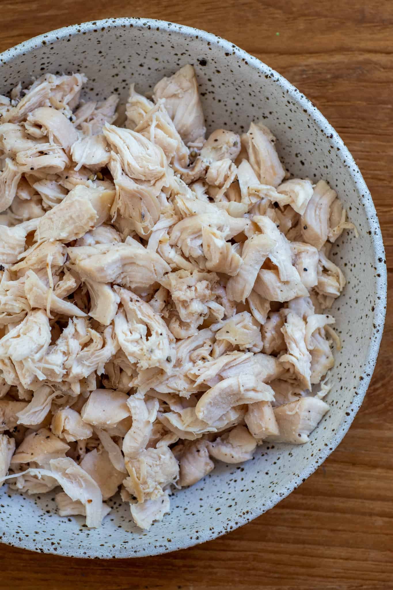 A bowl of shredded chicken 